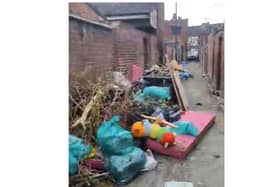 The footage shows the alleyway in Hyde Park strewn with piles of rubbish.