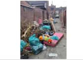 The footage shows the alleyway in Hyde Park strewn with piles of rubbish.