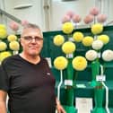 Paul pictured with some of his prize winning dahlias at The National Dahlia Society Northern National Show, formerly known as Harrogate Show.