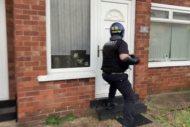 A warrant being carried out as part of Operation Duxford.