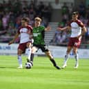 Doncaster's Bobby Faulkner challenges for the ball against Northampton Town.