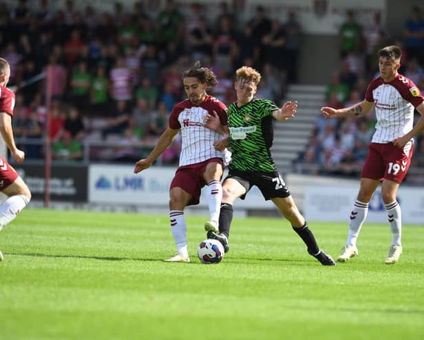 Doncaster's Bobby Faulkner challenges for the ball against Northampton Town.