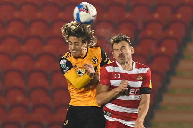 Andy Butler tangles with Wolves' record signing Fabio Silva. Picture: Andrew Roe/AHPIX