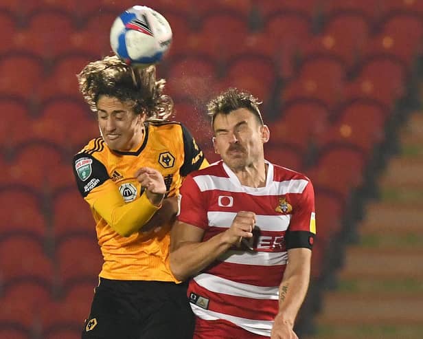 Andy Butler tangles with Wolves' record signing Fabio Silva. Picture: Andrew Roe/AHPIX