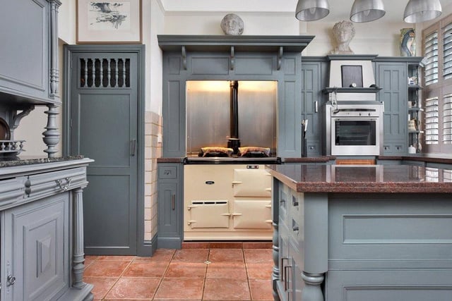 The breakfast kitchen contains units and an island surmounted by granite work surfaces, a gas fired Aga, a further electric oven, and windows with plantation shutters.