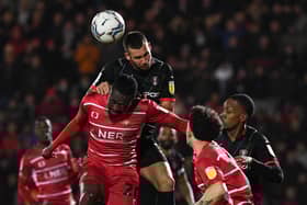 Joe Dodoo is beaten to a header