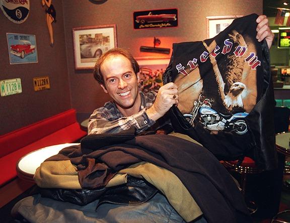 Karisma night club general manager, Tony Whiteside, is seen with some of the many clothes left at the club that were to be donated to Oxfam, September 1996