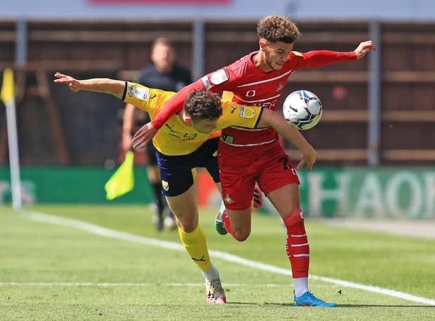 Rovers' goalscorer Josh Martin battles with Oxford's Luke McNally. Picture: Gareth Williams/AHPIX LTD