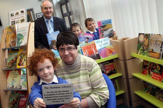 Pupils at Abercrombie Primary school enjoy their new library in 2011. Six-year-old Charlotte Thompson with Ann Denman former govenor, Head teacher Mr Neil Jones. with William and Philip Riley aged eight