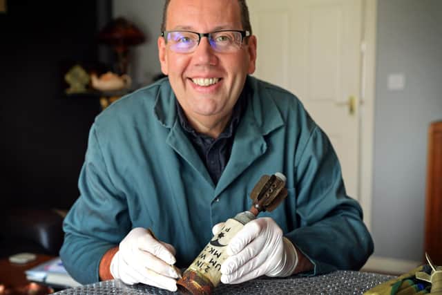 Graham Key, pictured with a Flare Casing he is conserving for a client. Picture: NDFP-15-09-20-Key 6-NMSY