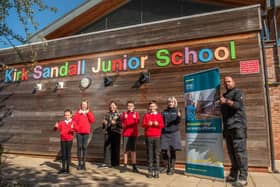 Kirk Sandall school students celebrate the solar panel installation.