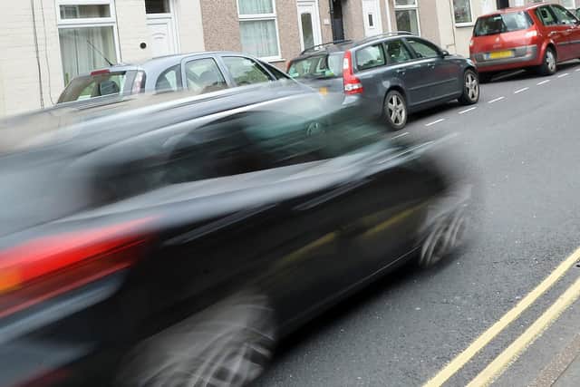 Stock image of speeding car.