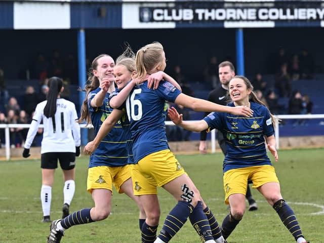On the up again: Doncaster Rovers Belles players celebrate Arianne Parnham's goal in a recent game with Barnsley as they look to re-establish themselves on and off the pitch. (Picture: Howard Roe/AHPIX LTD courtesy of Doncaster Rovers Belles)