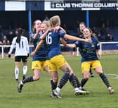 On the up again: Doncaster Rovers Belles players celebrate Arianne Parnham's goal in a recent game with Barnsley as they look to re-establish themselves on and off the pitch. (Picture: Howard Roe/AHPIX LTD courtesy of Doncaster Rovers Belles)