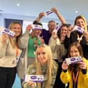 Staff at Bluebell Wood Children’s Hospice celebrate the launch of the charity’s raffle.