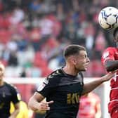 Jordy Hiwula battles with Charlton's Sam Lavelle for the ball. Picture: Andrew Roe/AHPIX LTD