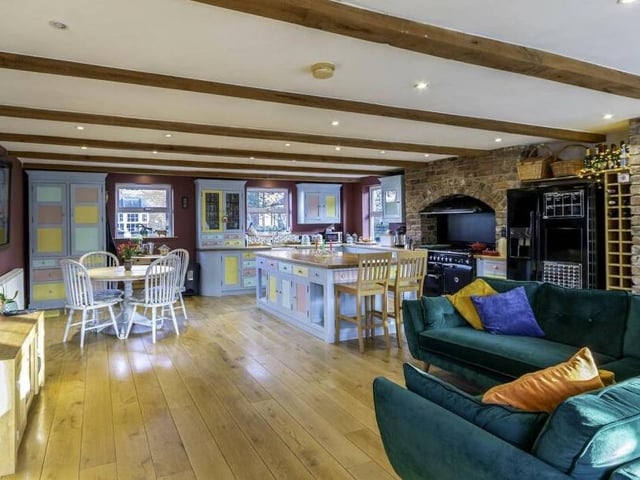 The beamed open plan dining and living kitchen.