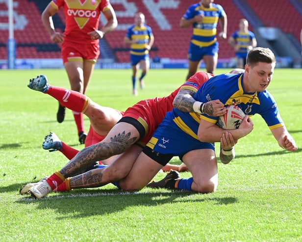 Josh Guzdek scores for the Dons. Picture: Andrew Roe/AHPIX LTD