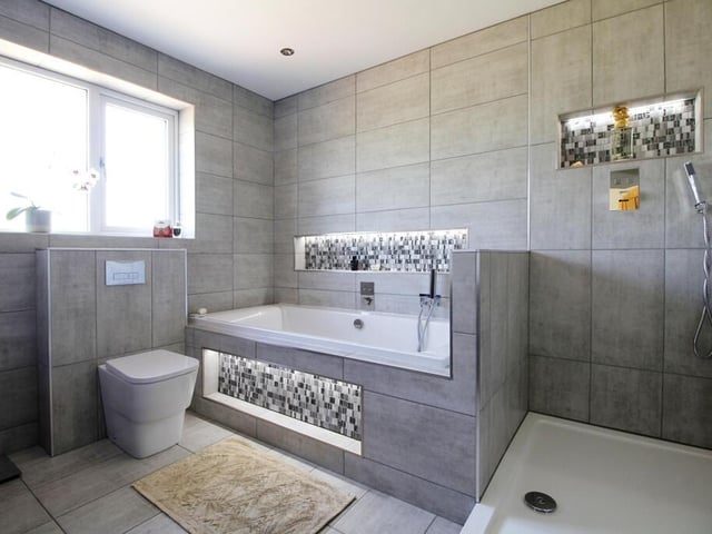 A contemporary style bath with shower room.