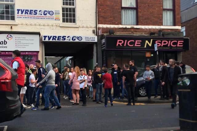 This photo shows a crowd had gathered in the town centre.