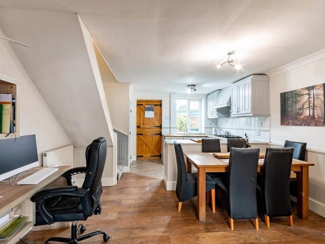 The home office and dining areas within the versatile indoor space.