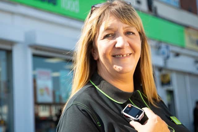 A colleague with one of the body camera's being rolled out to more stores at Central England Co-op