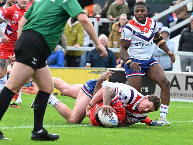 Jason Tali scores for the Dons. Picture: Howard Roe/AHPIX.com