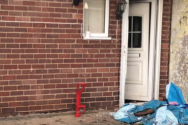 Police broke down the door of one a property on Woodlea Grove whilst they conducted a warrant.