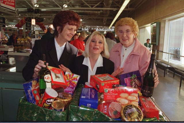 Doncaster Asda customer service manager Dawn Etheridge presented hamper winners Joan Roope (right) of Barnsley Dun, and Pam Noble, of Edenthorpe, with their prizes in 1999