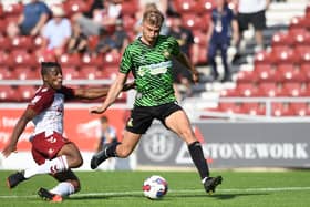 George Miller goes through on goal against Northampton Town.