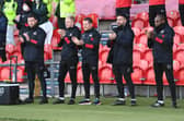 Gary McSheffrey, centre, and his backroom staff.