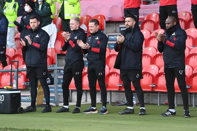 Gary McSheffrey, centre, and his backroom staff.