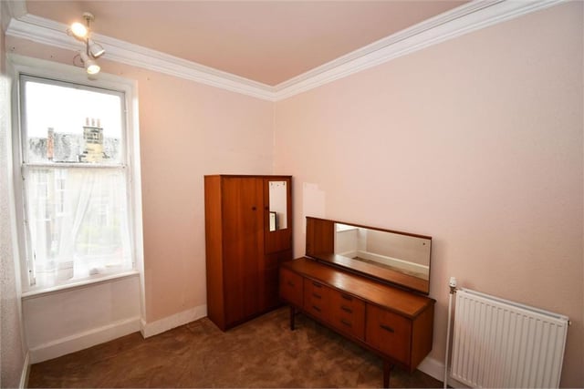 That dark wood furniture with the salmon pink walls? Yes please.