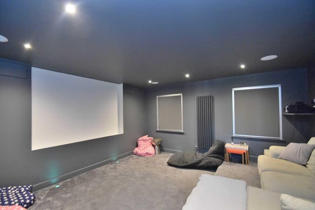 The private home cinema is hidden by a secret wall, making it the ideal space to sneak away and enjoy some entertainment on the large screen in comfy surroundings.