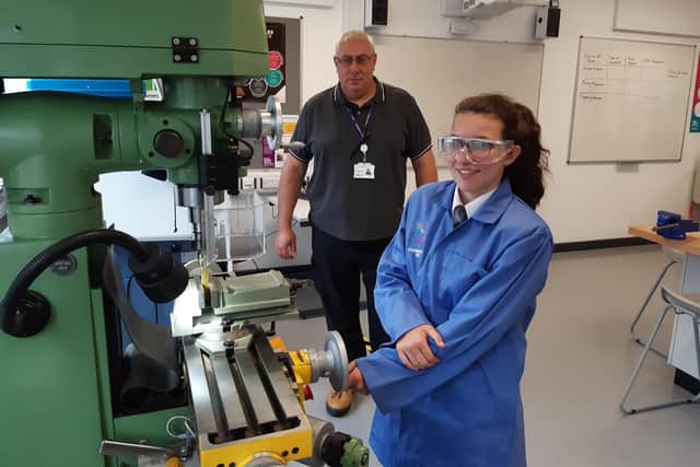 Paul Marshall, engineering technician, working with a pupil on the engineering equipment at Doncaster Univerity Technical College