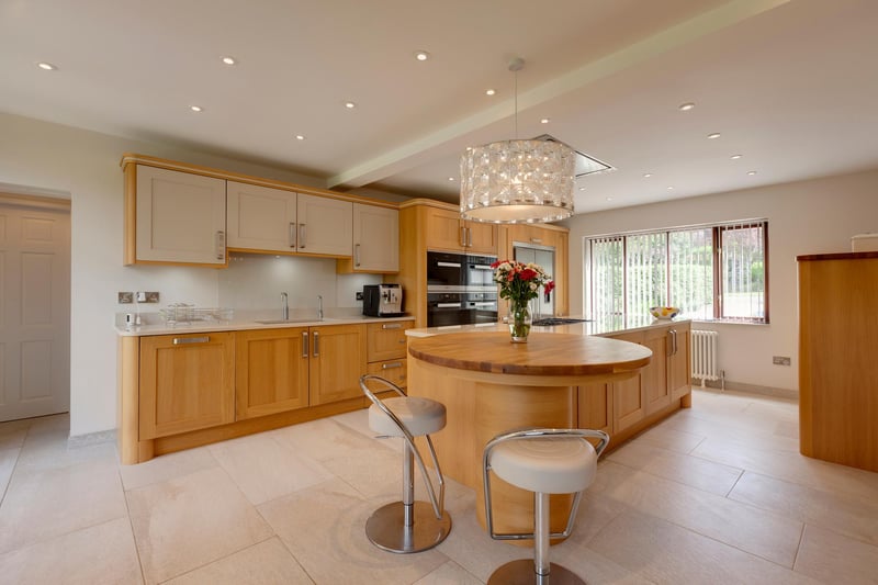 A stunning open plan dining kitchen has a luxury kitchen by Karl Benz. It has front and rear facing timber double glazed windows, recessed lighting, pendant light point, central heating radiators, TV/aerial point and tiled floor with under floor heating.