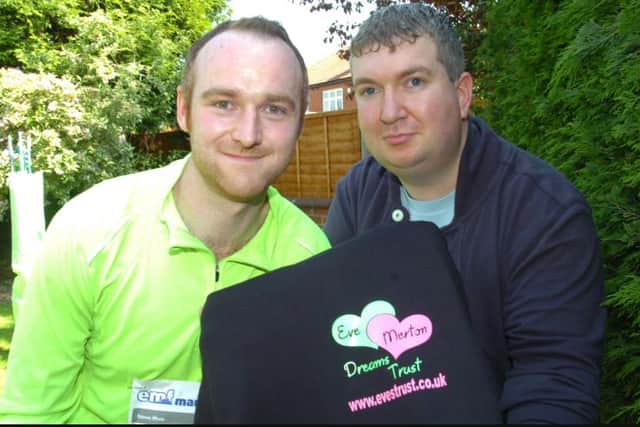 Martin Lewis photographed with Steven Moss who ran a marathon to raise funds for the charity.