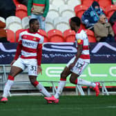 Niall Ennis celebrates his goal against Wycombe Wanderers with Madger Gomes