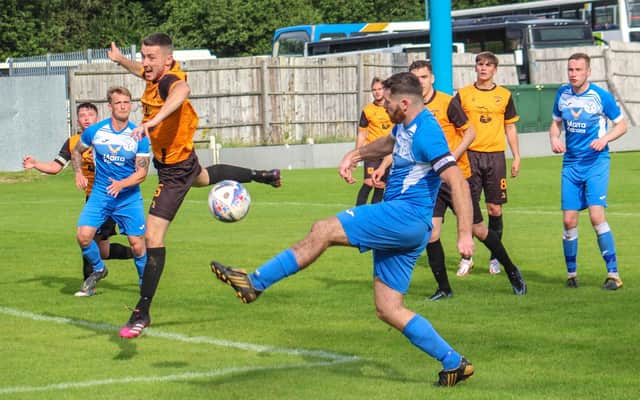 Action from Armthorpe Welfare's FA Vase clash at New Mills. Photo: Steve Pennock