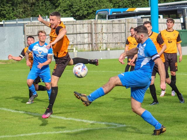 Action from Armthorpe Welfare's FA Vase clash at New Mills. Photo: Steve Pennock