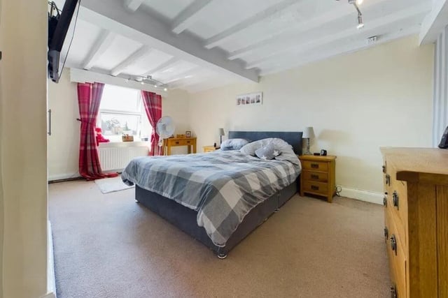Another sizeable, and beamed double bedroom within the property.