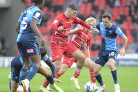 Tiago Cukur battles for the ball during last weekend's defeat to Wycombe. Photo: Howard Roe/AHPIX LTD