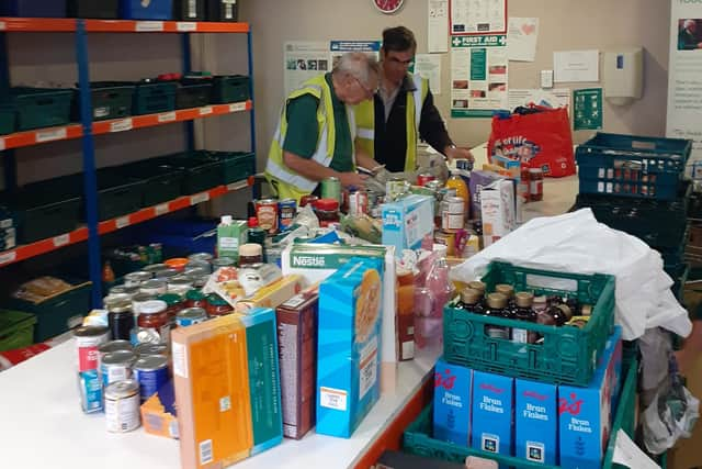 Roger and Alan at the foodbank warehouse.