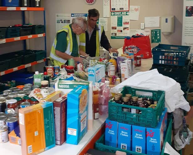 Roger and Alan at the foodbank warehouse.