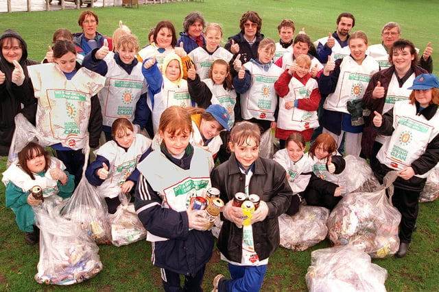 Alana Jones (standing,fourth from right), who works at McDonalds, Doncaster, organised a litter-pick at Sandall Park involving scouts from Barnby Dun and Edenthorpe and guides and brownies from Conisbrough in 1998. Our picture shows Becky Stephenson, aged ten, and non-guide Kaylee Daniels, aged nine, who came along to help with her mum, McDonalds worker Corrine Steadman.