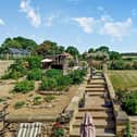 The property's extensive garden adjoins open countryside.