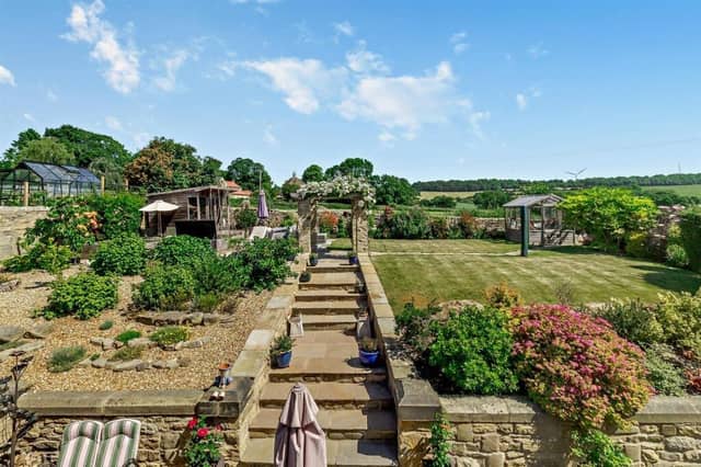 The property's extensive garden adjoins open countryside.