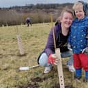 A mother and child enjoying the community planting event