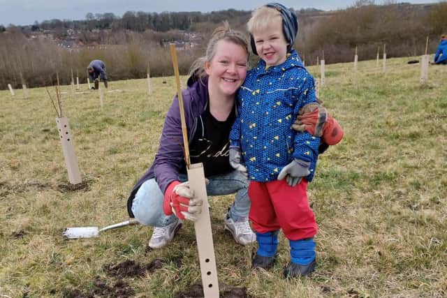 A mother and child enjoying the community planting event