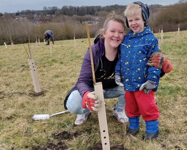 A mother and child enjoying the community planting event